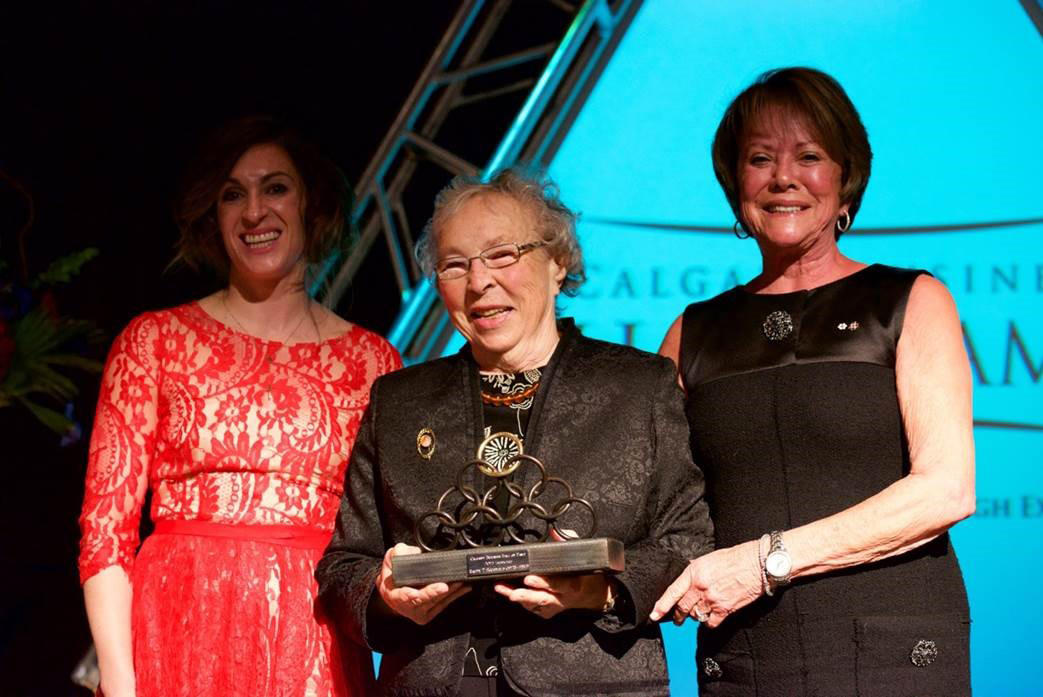 From left: Kendra Scurfield and Sonia Scurfield (Ralph Scurfield's widow) are presented with the Calgary Business Hall of Fame award by Ann McCaig at the 2015 Calgary Business Hall of Fame Gala on Oct. 22, 2015.