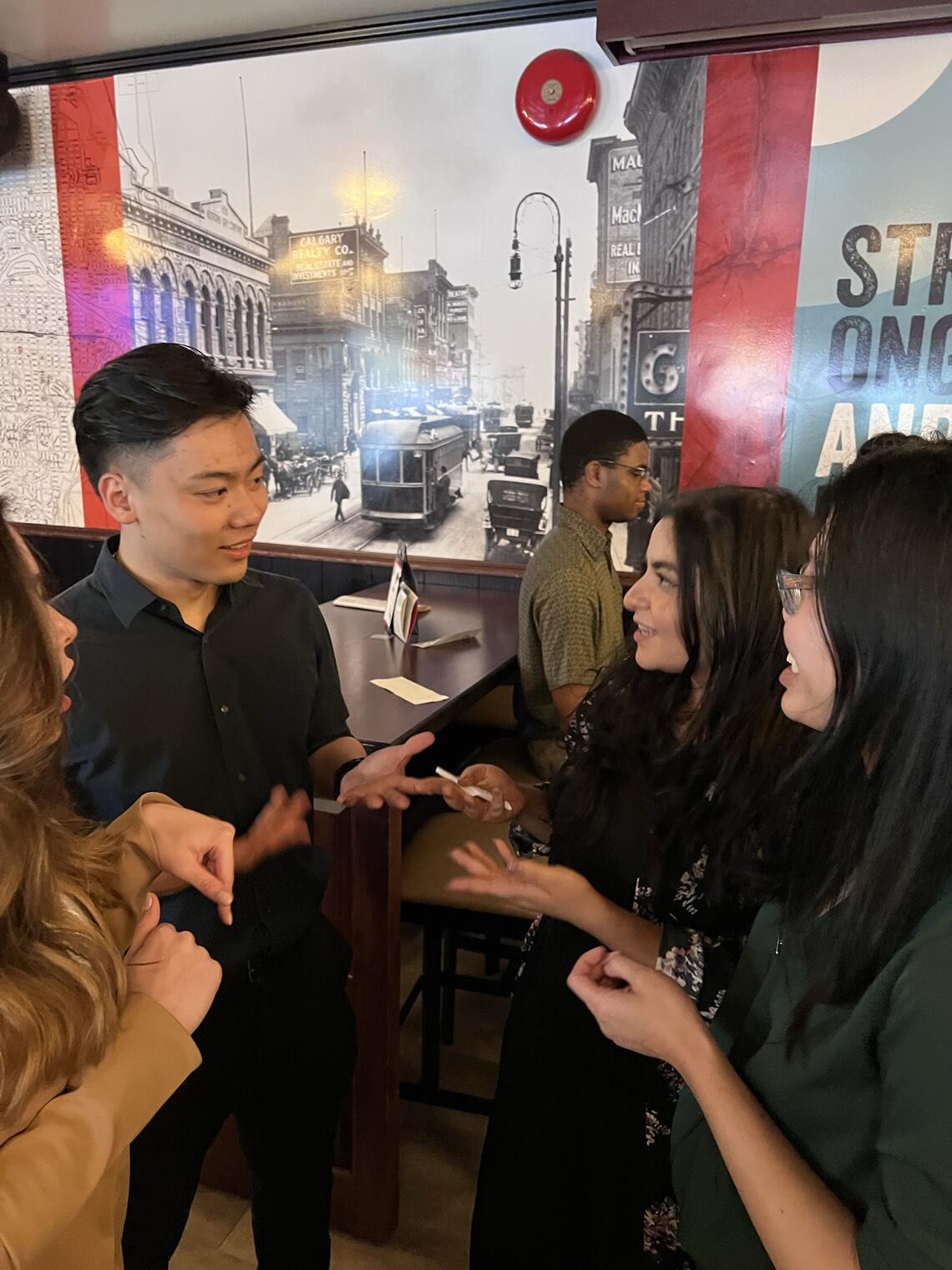 Members of the Master of Management Alumni alliance enjoying some conversation at an after work meet-up.