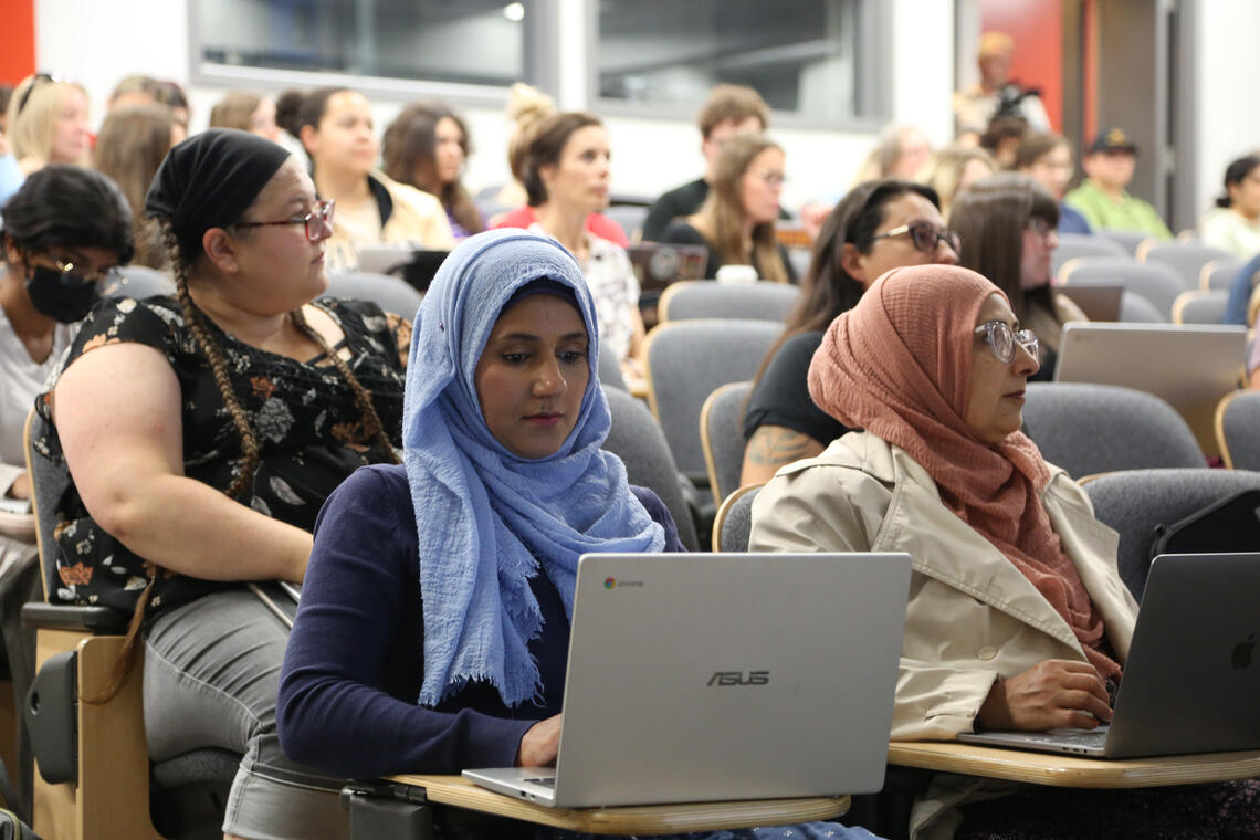 Students seated in a lecture hall