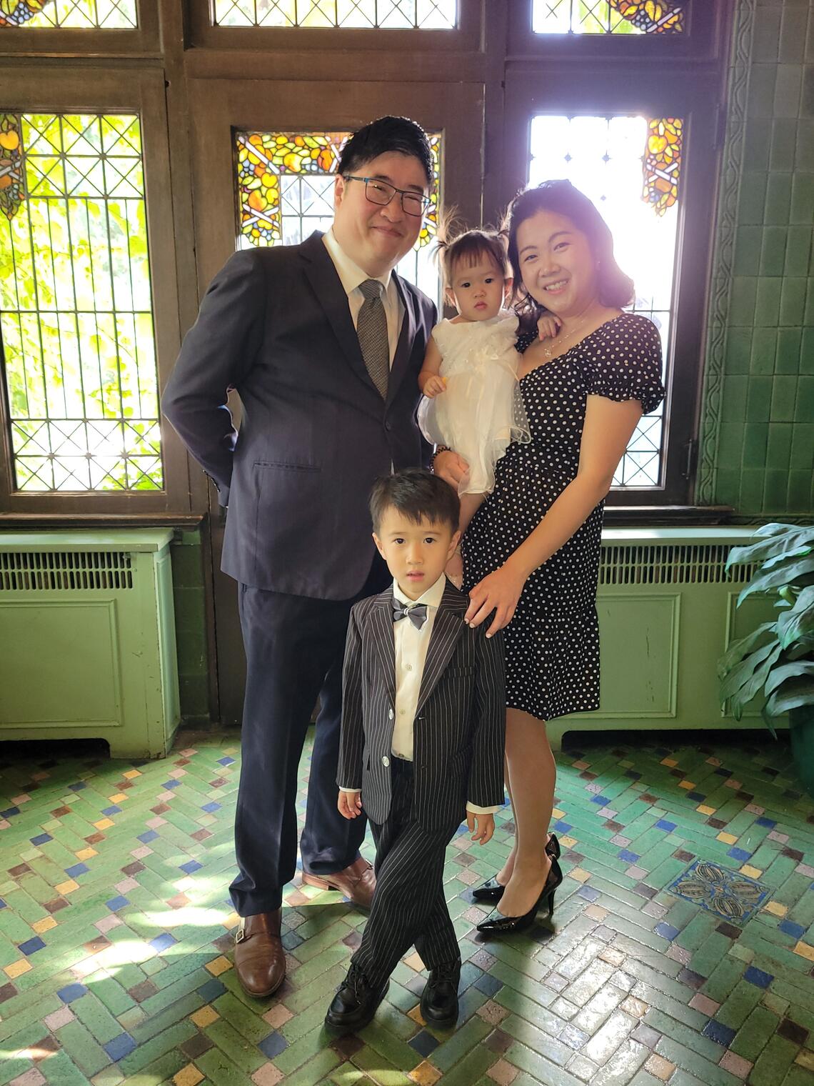 Ben Leung, JD’14, and Edith Thai, JD’15, with their children.