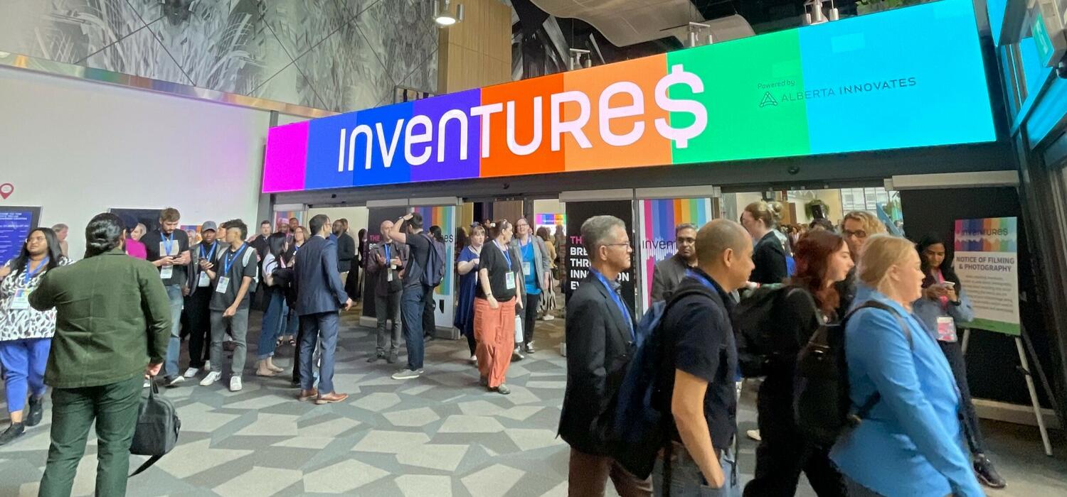 Inventures screen with different colours with attendees walking around