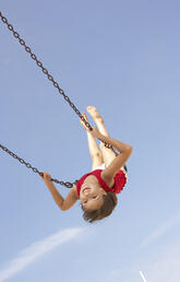 Smiling child on swing