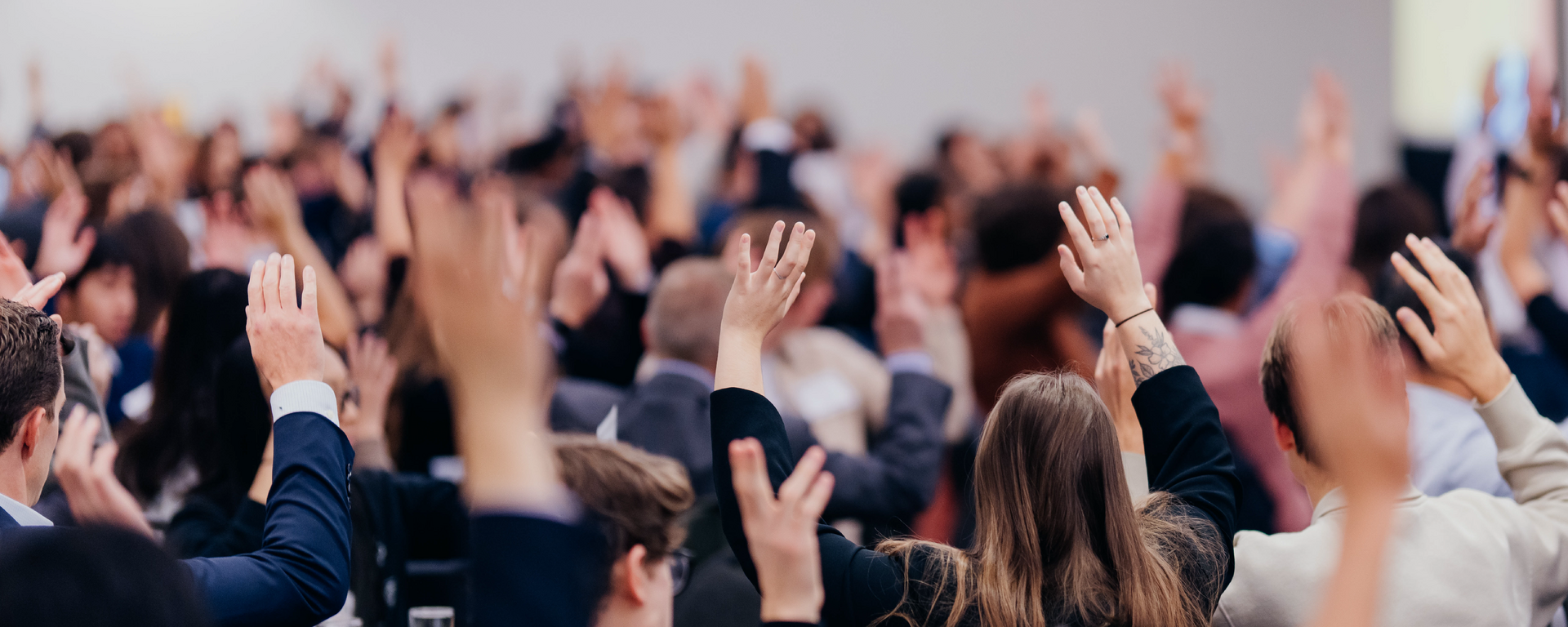 Join the Haskayne Centres community banner with community members raising their hands.
