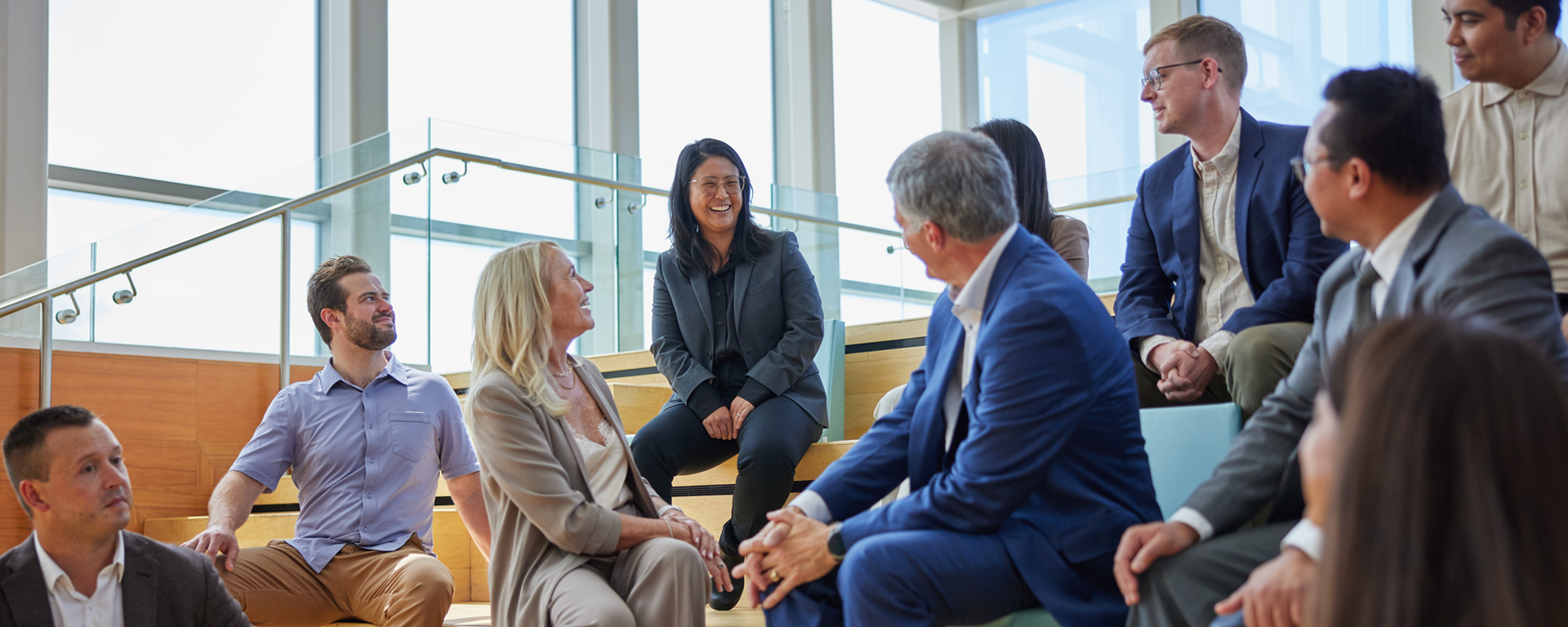 Al Monaco and Sue Tomney chatting with Haskayne MBA students