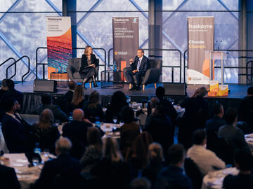 Wide shot of Jackie Forrest and Carlos Pascual on stage