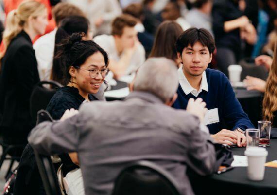 Mentor talking to Haskayne students