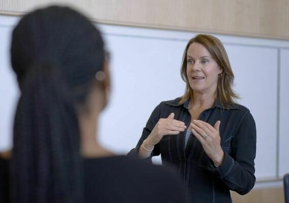 Whitney Rockley speaking with students after a panel discussion