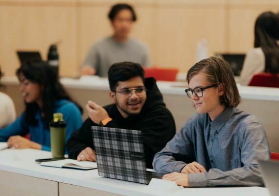 Student chatting during a class project