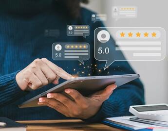 Tablet with artiifcal screen showing business reviews for a website. 